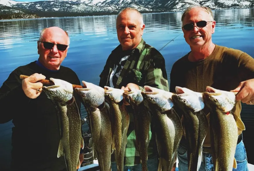 People Holding Fish